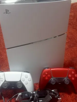 Sony PlayStation 5 Slim Edition with two original controllers and a charging stand