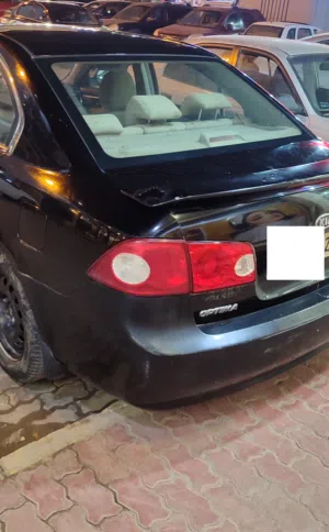 كيا اوبتيما  محرك 24  مارشه عادية  محرك كمبيو صالة ماشاءالله  سيرفس كامل  سعر 8.5  الف