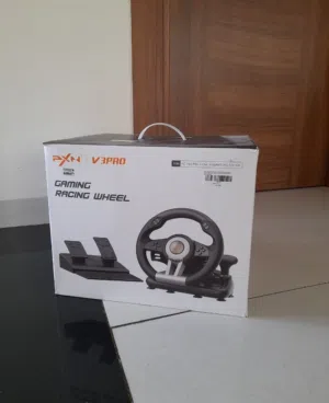 للبيع مقود القيادة الشهير PXN V3Pro Gaming Racing Wheel، الخيار المثالي لعشاق ألعاب السيارات والسرعة