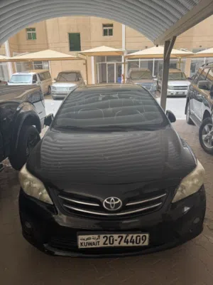 Used 2012 Toyota Corolla Sedan with Electric Mirrors and Air Conditioning in Black