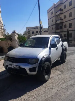 موتسيبيشي L200 بيك اب 2009 رمادي ديزل مرخصة بحالة جيدة بسعر مناسب