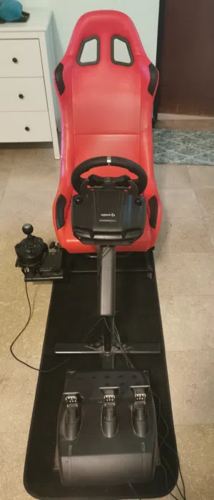 XBOX Racing Simulator Package with Logitech drivers steering wheel, gear stick and racing pedals.