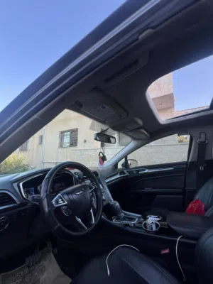 Ford Fusion 2013 Titanium ( أنيرجي ) بحالة الوكالة فورد فيوجن بنظام الكهرباء