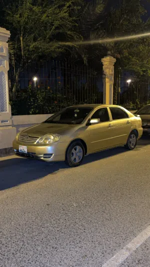 تيوتا كورلا 2003 ذهبي