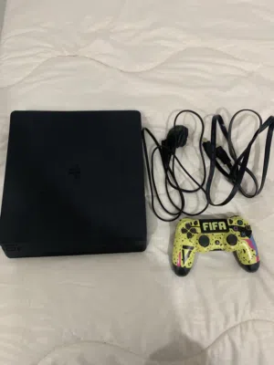 PlayStation 4 with 3 cd’s 1 controller
