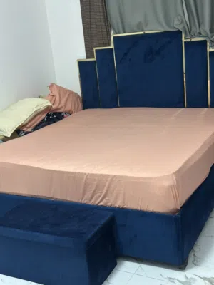 King size blue velvet bed frame with headboard and mattress and leg stand