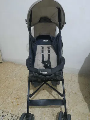 عرباية اطفال ماركة infanti مستعملة وكالة مظلة مطر وشمس