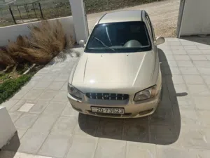 سيارة فيرنا 2002 ذهبي موديل كوريا فابريكا وكالة حالتها جيدة