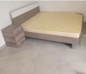 King size bed with side table and dressing table