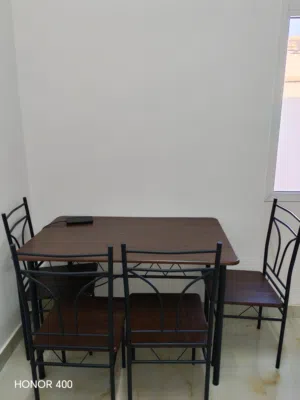 Wooden table with 4 steel chairs
