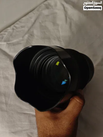 عدسة كانون سيكما ( 85mm - 1.4f ) جدا نظيفة بسعر 700 الف دينار وبي مجال 3