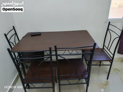 Wooden table with 4 steel chairs 2