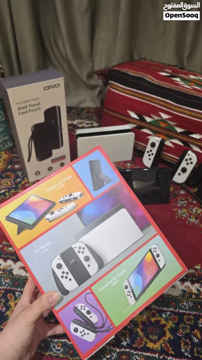 Nintendo Switch OLED نينتندو سويتش اوليد أبيض مع 4 ألعاب أصلية + يدات إضافية + حقيبة + الكرتون 3