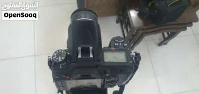 كاميرا نيكون D7000 مه ملحقاتها مع ستاند هيدروليك مضاد اهتزاز 3