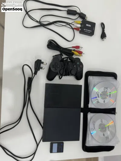 جهاز بلايستيشن 2 مستعمل مع يد تحكم و ميموري 8MB مع 34 شريط وحافظة أشرطة مع منفذ محول من AV الى hdmi 2