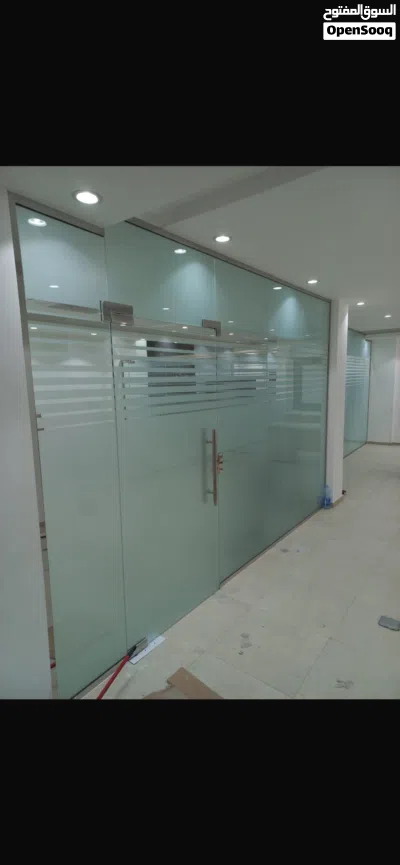 تركيب الزجاج والألمنيوم والفولاذ. Glass aluminium and steel work 2