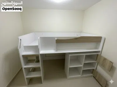 white bed with stairs,cabinets,and shelves 2