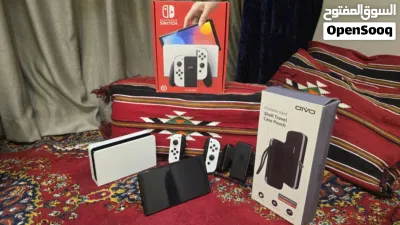 Nintendo Switch OLED نينتندو سويتش اوليد أبيض مع 4 ألعاب أصلية + يدات إضافية + حقيبة + الكرتون 4