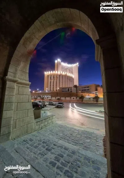 مبنى تجاري محلات وشقتان مأجرات على رئيسي 15االطير 2