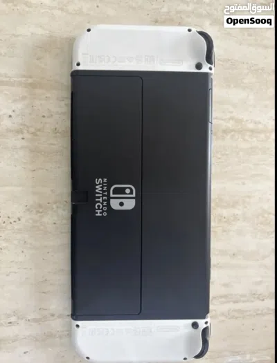 نينتندو OLED مع ثلاث ألعاب قوية ويد إضافية 3