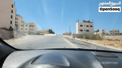 قطعة ارض بالمستندة الغربية على شارع 30 موقع مميز و مرشحه ان تصبح تجاري/ اقبل بدل على شقة في اسكان 4