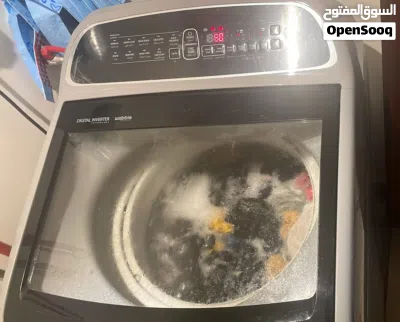 This is a Samsung top load washing machine featuring a dark gray, tempered glass lid 11kg 2