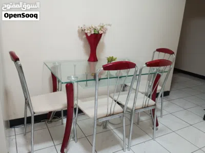 Glass-top dining table with 4 chairs (red legs, white seats) 2