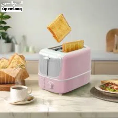 حمّاصة خبز كهربائية لشريحتين (2-Slice Toaster) بلون وردي وتصميم ريترو مميز، تبلغ قدرتها الكهربائ 3