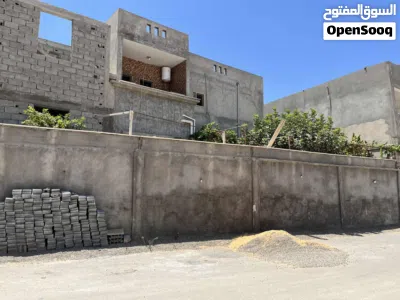 أرض 500 متر مقام عليها منزل دورين كاملات ومنزل هيكل مسقف قيد الانشاء جنان دور الداير واجهة 27متر 2