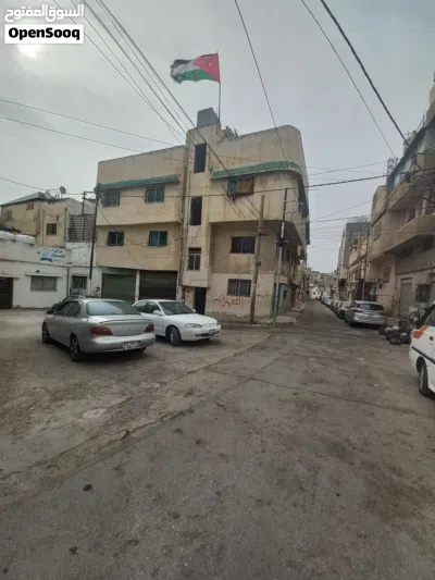 عمارة ثلاث طوابق 7 شقق و 6 مخازن بدخل 10800 سنوي 2