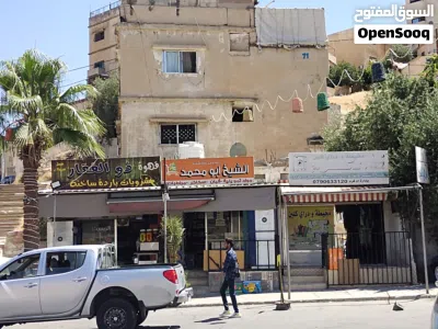 عمارة سكنية للبيع مع 3 مخازن على الشارع الرئيسي 3