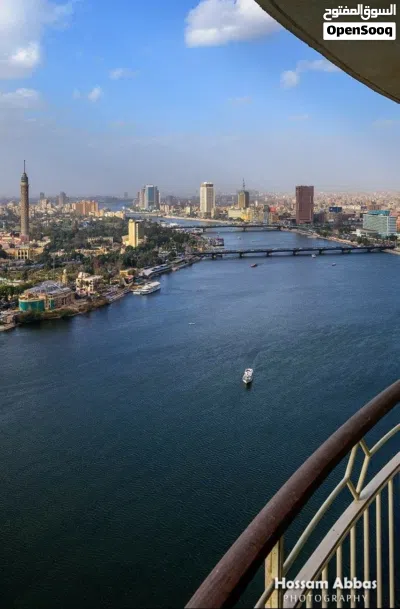عاين على ارض الواقع شقة فندقية متشطبة بالتكيفات و الفرش و الاجهزة على النيل مباشرة بجوار فندق هيلتون 4
