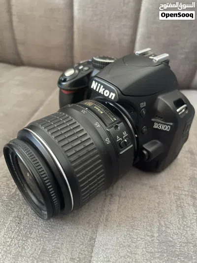 مع عدستان و ترايبود وملحقات اخرى Nikon D3100 2