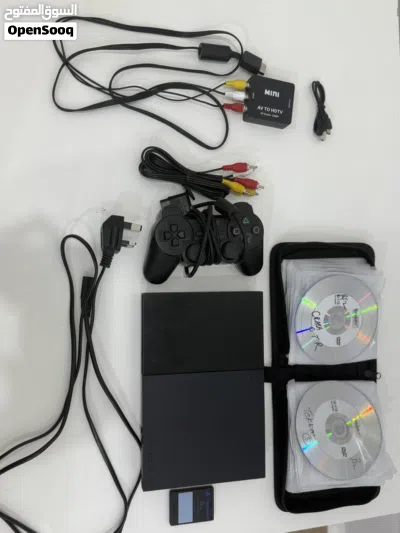 جهاز بلايستيشن 2 مستعمل مع يد تحكم و ميموري 8MB مع 34 شريط وحافظة أشرطة مع منفذ محول من AV الى hdmi 3