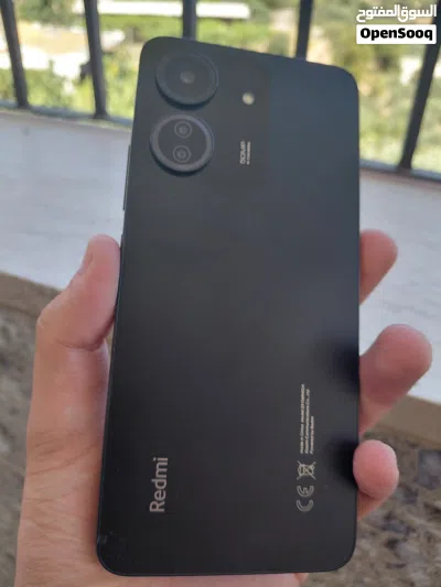 هاتف Mi Redmi 13C للبيع بسعر حرق التلفون ولا خدش جبار باللون الاسود مع سماعة ايربود هديه 4