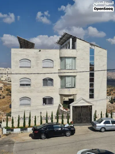 عمارة سكنية شارع الستين وليست اسكانات خمس طوابق وتسوية شقق طابقية كل شقة طابق مساحة كل شقة 266 متر 2
