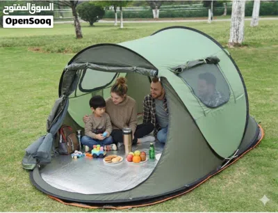 3-4 Person Instant Outdoor Tent designed for camping or beach use, featuring a green and black color 2