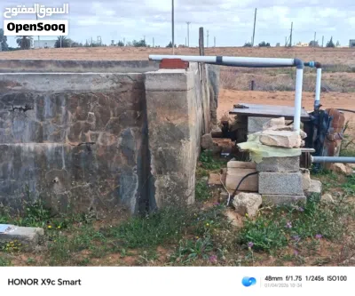 ارض هكتارين و 9000متر جنب الرئيسي طريق مطار 2