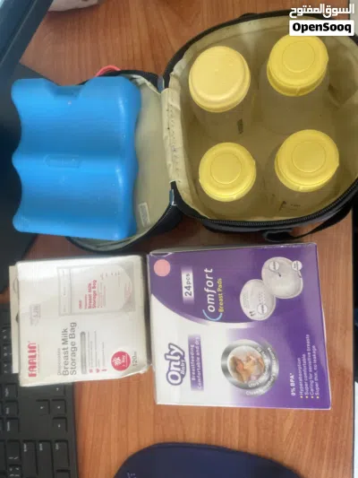 Medela Swing Single Electric Breast شفاط حليب ميديلاPump عبوات حفظ الحليب cooler bag و 2