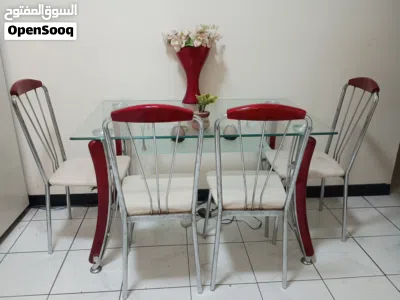 Glass-top dining table with 4 chairs (red legs, white seats) 4