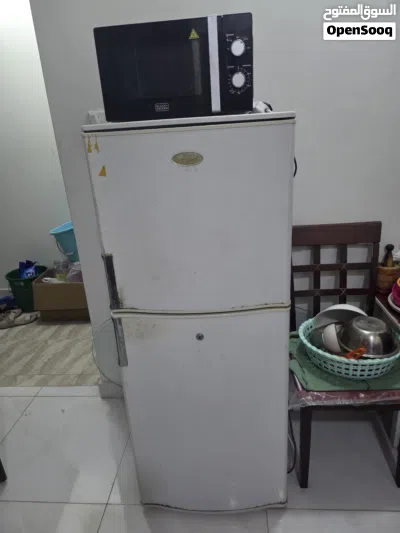 Bed with maters, cupboard, washing machine, small Fridge, TV with dish & setup box 4