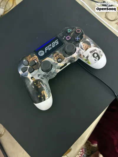 A barley used ps4 pro 1 terabyte 2 controllers and a charger 3