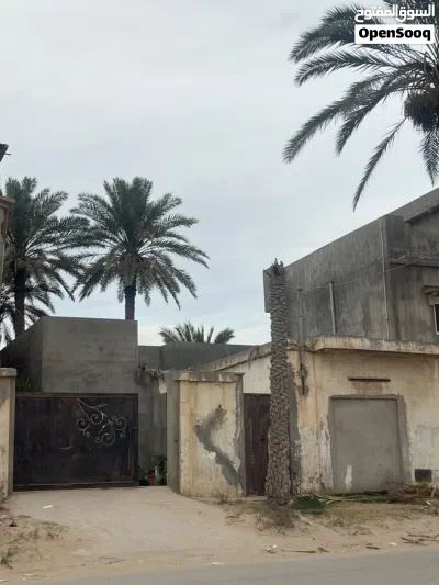 قطعة ارض 260 متر مربع يوجد عليها منزل وقراج 2