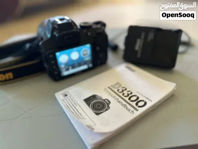 نيكون D3300 بحالة الوكاله مع عدسه TAMRON 2
