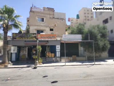 عمارة سكنية للبيع مع 3 مخازن على الشارع الرئيسي 2