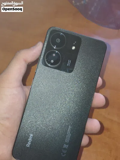 هاتف Mi Redmi 13C للبيع بسعر حرق التلفون ولا خدش جبار باللون الاسود مع سماعة ايربود هديه 2