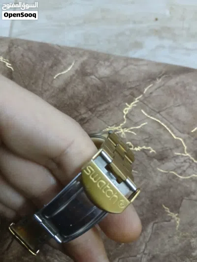 ساعة سواتش لون جولد فخمة ونادرة 2