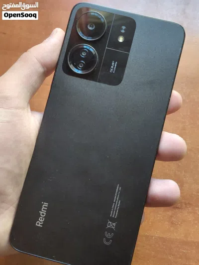 هاتف Mi Redmi 13C للبيع بسعر حرق التلفون ولا خدش جبار باللون الاسود مع سماعة ايربود هديه 3