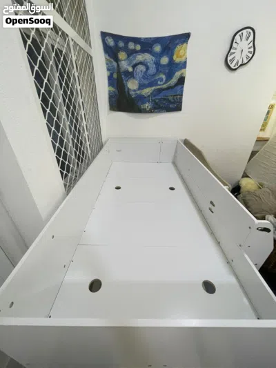 white bed with stairs,cabinets,and shelves 3