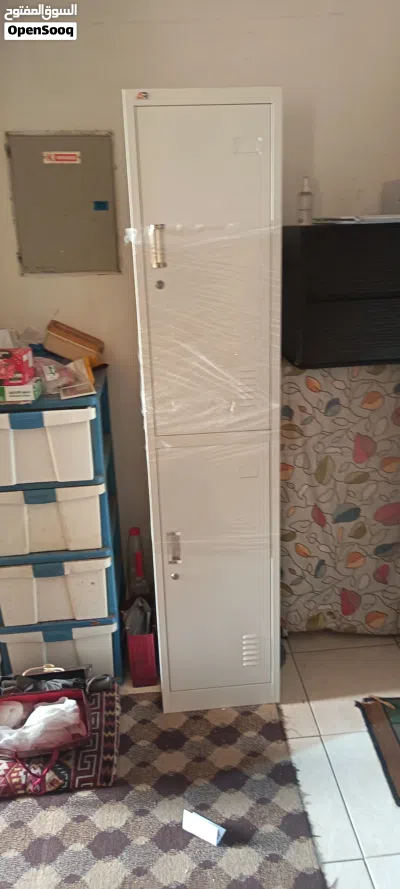 One big wodden cabinet white neat and clean. 3